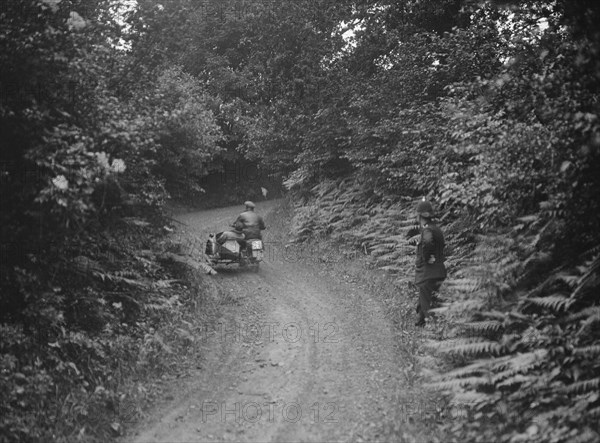 Motorcycle and sidecar, B&HMC Brighton-Beer Trial, Simms Hill, Ilsington, Devon, 1930. Artist: Bill Brunell.