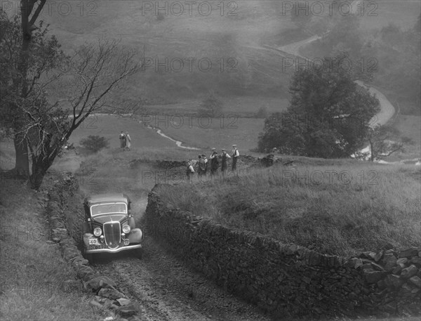 Ford V8 saloon of F Allott competing in the MCC Sporting Trial, 1935. Artist: Bill Brunell.