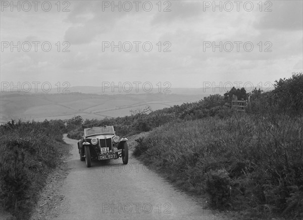 MG TA of WC Kendrick competing in the MCC Torquay Rally, 1938. Artist: Bill Brunell.