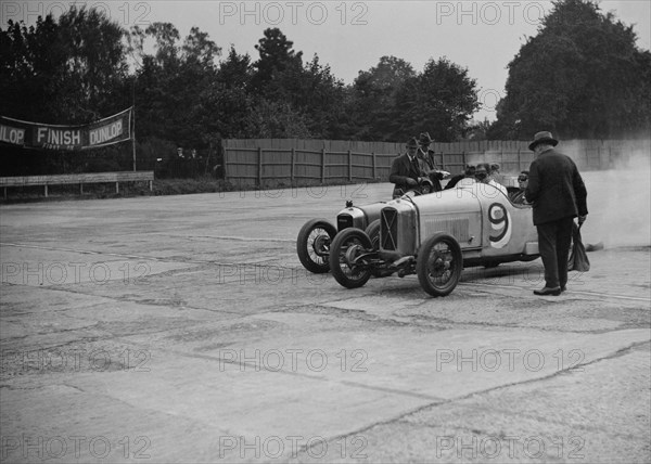 Salmson and Amilcar competing in a race at a Surbiton Motor Club meeting, Brooklands, Surrey, 1928. Artist: Bill Brunell.