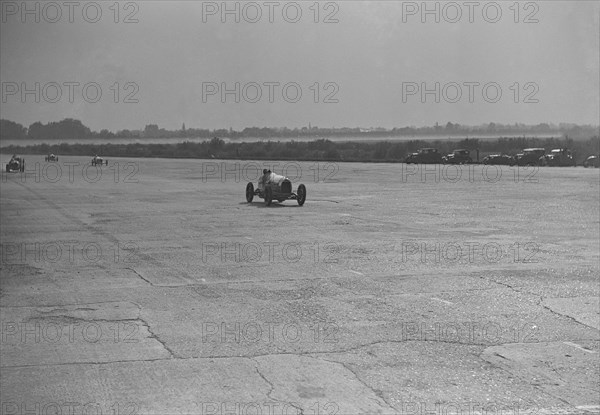 Delage racing at a Surbiton Motor Club race meeting, Brooklands, Surrey, 1928. Artist: Bill Brunell.