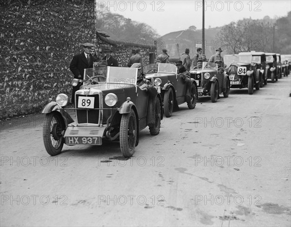 MG M type of EG Farrow at the head of a line of cars competing in the MCC Sporting Trial, 1930. Artist: Bill Brunell.