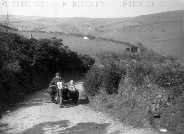 990 cc AJS and sidecar of CF Crossby at the MCC Lands End Trial, Beggars Roost, Devon, 1936. Artist: Bill Brunell.