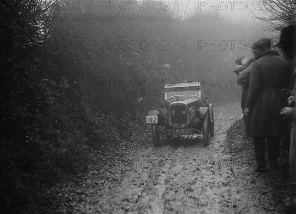 Austin 7 of HC Jacobs competing in the MCC Exeter Trial, Meerhay, Dorset, 1930. Artist: Bill Brunell.