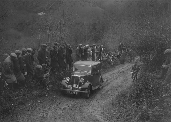 Standard saloon of GH Strong competing in the MCC Lands End Trial, 1935. Artist: Bill Brunell.