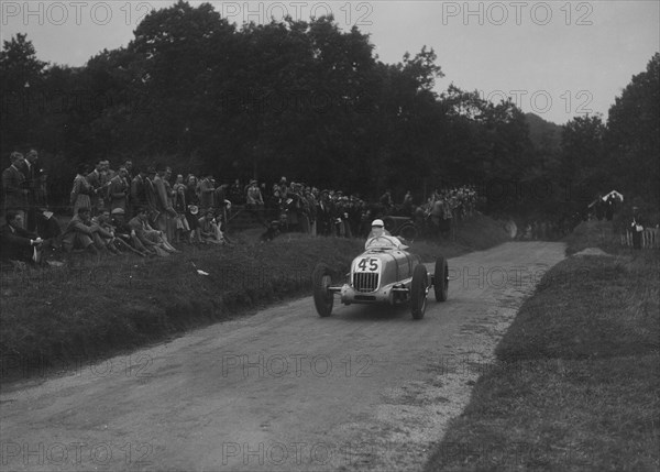 Unidentified open single-seater car competing in the Shelsley Walsh Hillclimb, Worcestershire, 1935. Artist: Bill Brunell.
