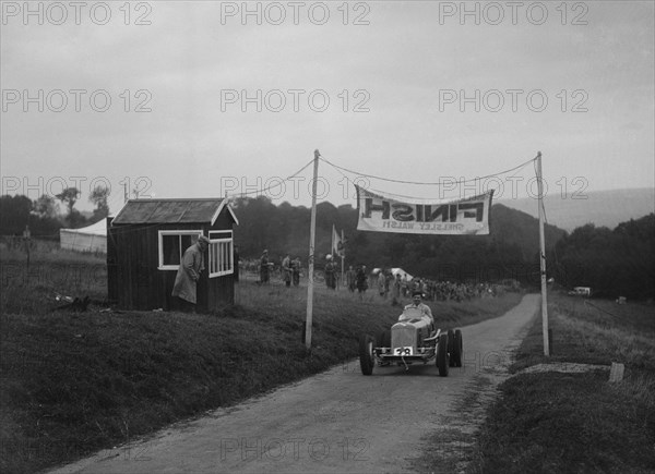 ERA of Raymond Mays at the finishing line of the Shelsley Walsh Hillclimb, Worcestershire, 1935. Artist: Bill Brunell.