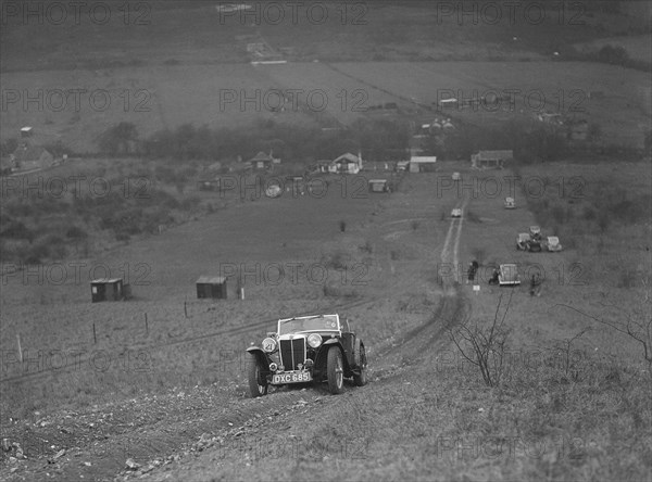 MG TA competing in the London Motor Club Coventry Cup Trial, Knatts Hill, Kent, 1938. Artist: Bill Brunell.