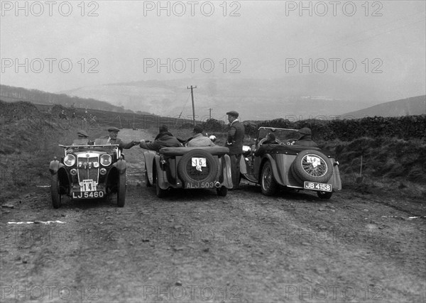 MG F type, Wolseley Hornet and MG Magnette at the Sunbac Inter-Club Team Trial, 1935. Artist: Bill Brunell.