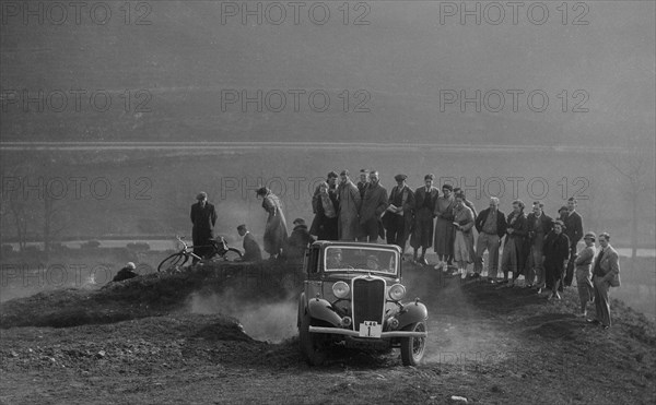 Singer saloon of Michael McEvoy competing in the Sunbac Inter-Club Team Trial, 1935. Artist: Bill Brunell.