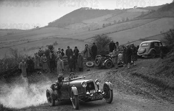 Aston Martin 2-seater of JD Keightley competing in the MG Car Club Midland Centre Trial, 1938. Artist: Bill Brunell.