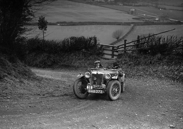 MG TA of NH Grove competing in the MG Car Club Midland Centre Trial, 1938. Artist: Bill Brunell.