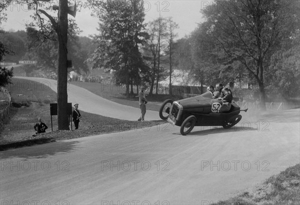 Austin 7 of B Sparrow about to crash, Donington Park Race Meeting, Leicestershire, 1933. Artist: Bill Brunell.