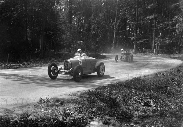 TP Cholmondeley-Tapper's Bugatti Type 37A leading a Frazer-Nash TT replica at Donington Park, 1930s. Artist: Bill Brunell.