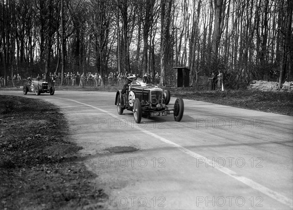 Frazer-Nash Byfleet II leading an MG at Donington Park, Leicestershire, 1935. Artist: Bill Brunell.