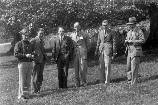 Group of men at Donington Park motor racing circuit, Leicestershire, c1930s. Artist: Bill Brunell.