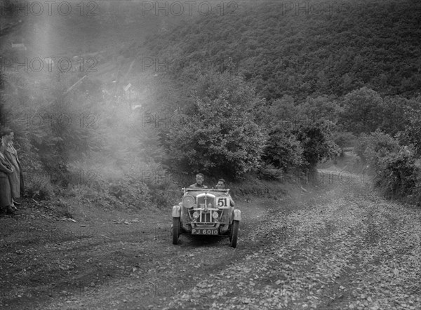 Wolseley Hornet competing in the Mid Surrey AC Barnstaple Trial, Beggars Roost, Devon, 1934. Artist: Bill Brunell.