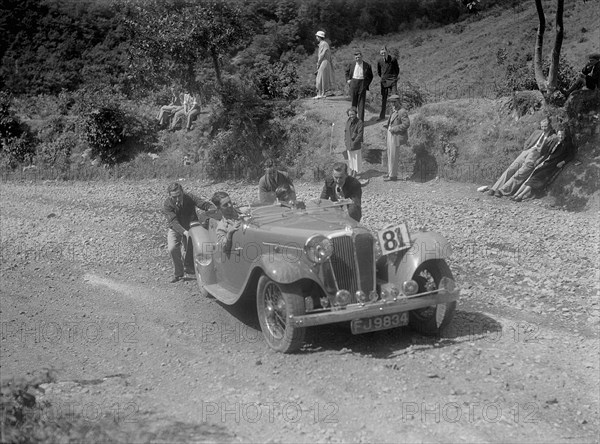 Jaguar SS open 2-seater at the Mid Surrey AC Barnstaple Trial, Beggars Roost, Devon, 1934. Artist: Bill Brunell.