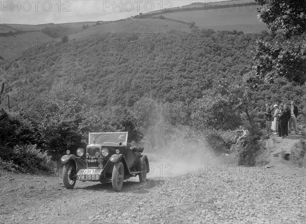 Riley 9 open 4-seater tourer at the Mid Surrey AC Barnstaple Trial, Beggars Roost, Devon, 1934. Artist: Bill Brunell.