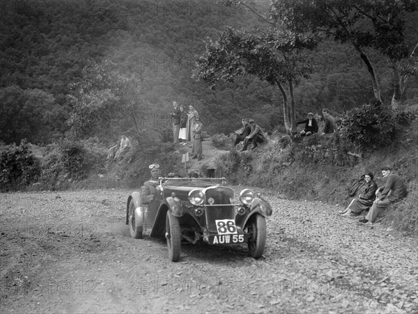 Singer sports 2-seater at the Mid Surrey AC Barnstaple Trial, Beggars Roost, Devon, 1934. Artist: Bill Brunell.