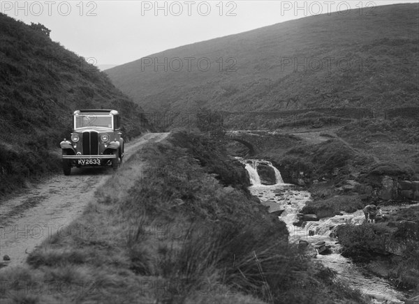 Kitty Brunell road testing a Standard Little Twelve saloon, c1932. Artist: Bill Brunell.