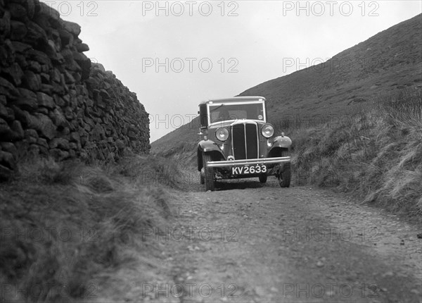 Kitty Brunell road testing a Standard Little Twelve saloon, c1932. Artist: Bill Brunell.