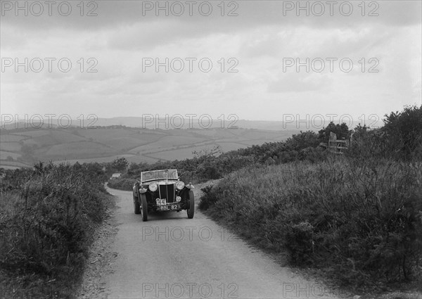 MG TA of RA MacDermid competing in the MCC Torquay Rally, 1938. Artist: Bill Brunell.