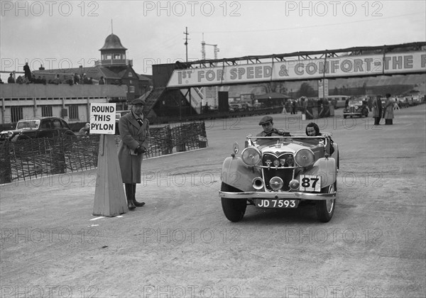 Riley Lynx competing in the JCC Rally, Brooklands, Surrey, 1939. Artist: Bill Brunell.