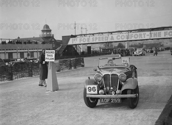 SS 2 competing in the JCC Rally, Brooklands, Surrey, 1939. Artist: Bill Brunell.