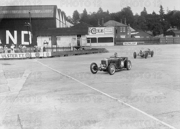 Frazer-Nash of RT Grogan leading Jack Lemon Burton's Bugatti T37, BARC meeting, Brooklands, 1933. Artist: Bill Brunell.