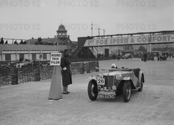 MG TA competing in the JCC Rally, Brooklands, Surrey, 1939. Artist: Bill Brunell.