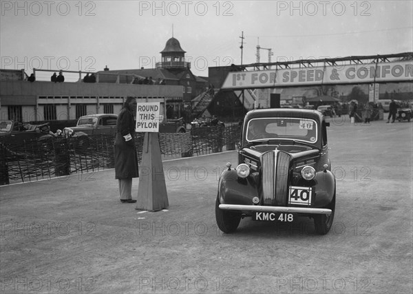 Standard saloon competing in the JCC Rally, Brooklands, Surrey, 1939. Artist: Bill Brunell.