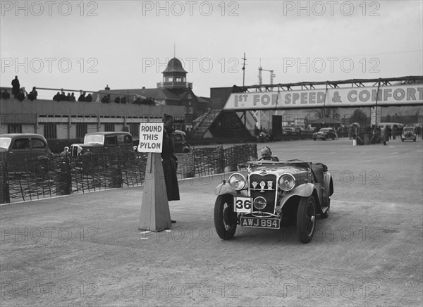 Singer sports competing in the JCC Rally, Brooklands, Surrey, 1939. Artist: Bill Brunell.