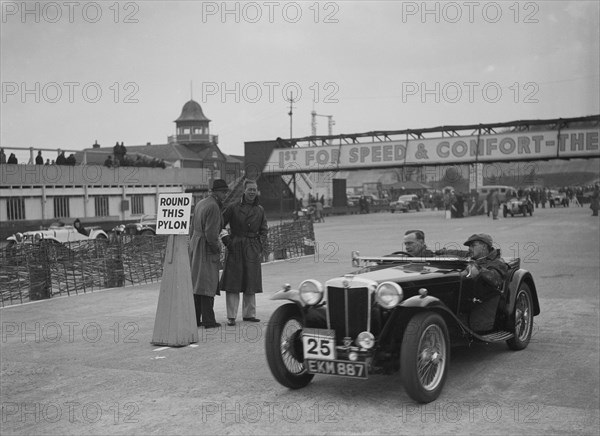 MG TA competing in the JCC Rally, Brooklands, Surrey, 1939. Artist: Bill Brunell.