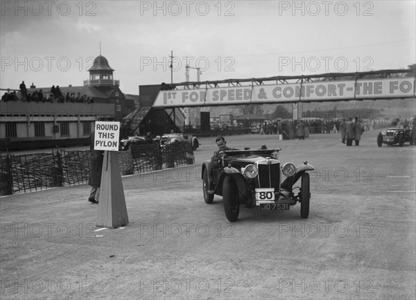 MG Magnette competing in the JCC Rally, Brooklands, Surrey, 1939. Artist: Bill Brunell.