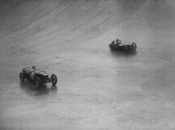 Riley 9 Brooklands and Austin 7 racing at a BARC meeting, Brooklands, Surrey, 1931 Artist: Bill Brunell.