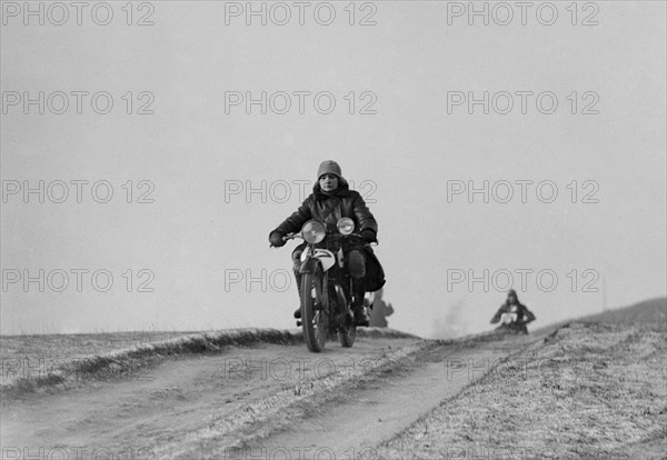 Motorcycle taking part in a trial, c1930s. Artist: Bill Brunell.