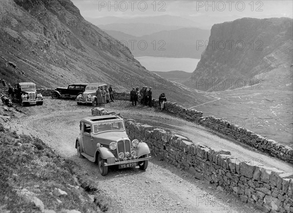 Rover 4-door saloon of IH Mackay competing in the RSAC Scottish Rally, 1936. Artist: Bill Brunell.