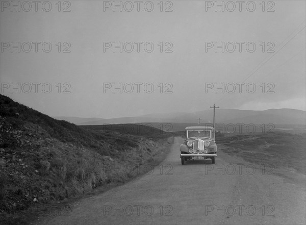 Rover of SJ Clutterbuck competing in the RSAC Scottish Rally, 1936. Artist: Bill Brunell.