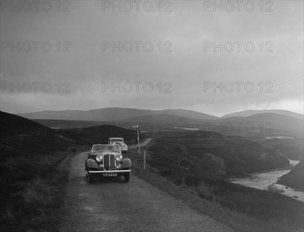 Rover open tourer of HE Gibbon competing in the RSAC Scottish Rally, 1936. Artist: Bill Brunell.