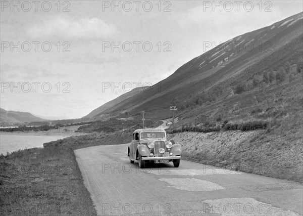 SS Jaguar of CL Bembridge competing in the RSAC Scottish Rally, 1936. Artist: Bill Brunell.