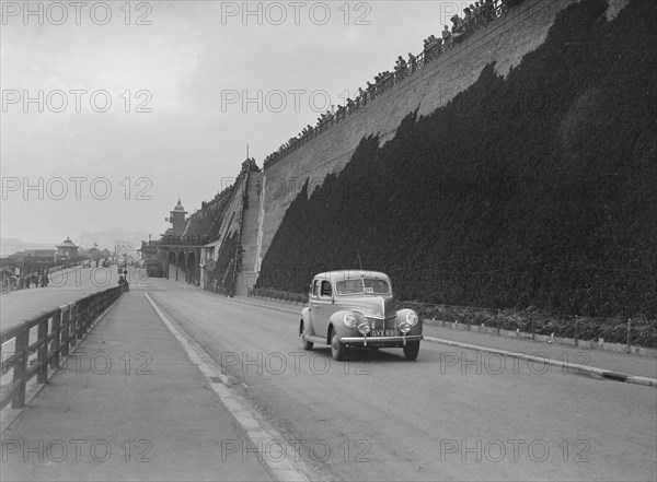 Ford V8 of CGH Barraclough on Madeira Drive, Brighton, RAC Rally, 1939. Artist: Bill Brunell.