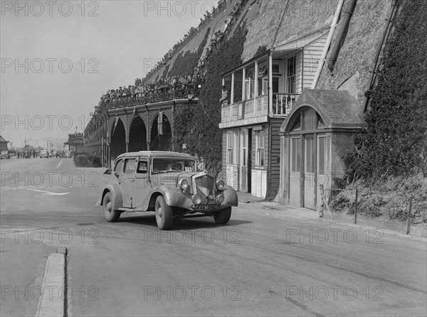 Wolseley saloon of HB Brownright and HE Symons on Madeira Drive, Brighton, RAC Rally, 1939. Artist: Bill Brunell.