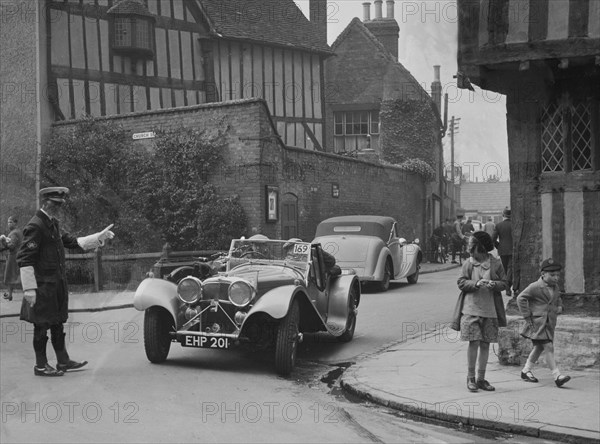 SS Jaguar 100 of SH Newsome competing in the RAC Rally, 1939. Artist: Bill Brunell.