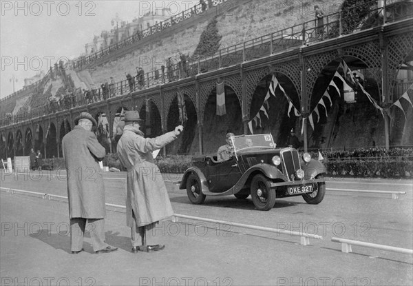 Morris open 2-seater of MC Browning on Madeira Drive, Brighton, RAC Rally, 1939. Artist: Bill Brunell.