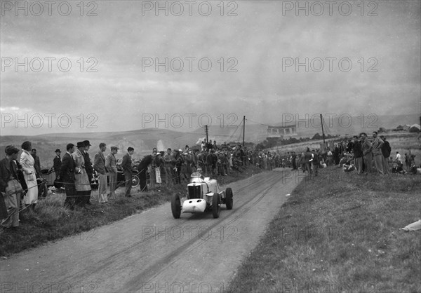 MG of JKW Baines competing in the Bugatti Owners Club Lewes Speed Trials, Sussex, 1937. Artist: Bill Brunell.