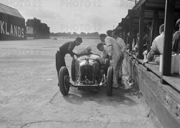 Amilcar C6 of Bill Humphreys in the pits, BRDC 500 Mile Race, Brooklands, 1931. Artist: Bill Brunell.