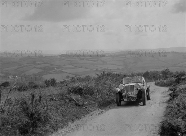 Singer B37 1.5 litre sports of EB Booth of the Autosports team at the MCC Torquay Rally, 1938. Artist: Bill Brunell.