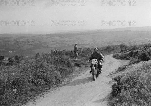 494 cc BMW motorcycle competing in the MCC Torquay Rally, 1938. Artist: Bill Brunell.