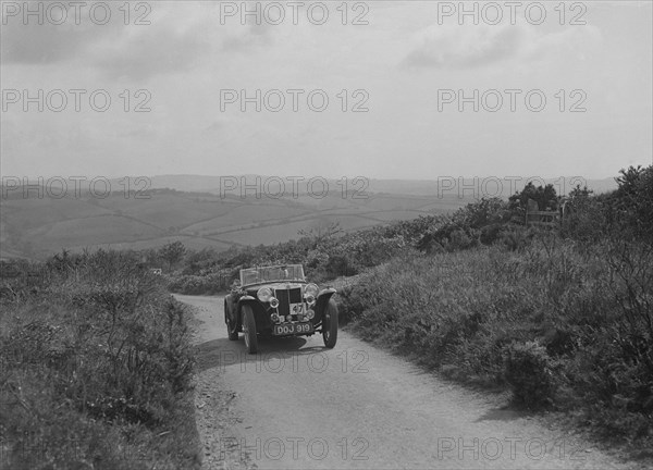 MG TA of JL Lutwyche competing in the MCC Torquay Rally, 1938. Artist: Bill Brunell.